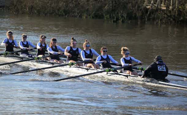 The women’s eight rowing away from the cameraman and looking quite aggressive on the Yare.